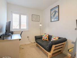 An office with a desk and a sofa at Inishnee House in Shotley Gate
