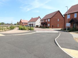 An outdoor view of residential houses along a circular road at Inishnee House in Shotley Gate