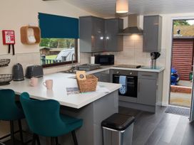A kitchen with modern fixtures and a doorway at Ramson in Saltburn-By-The-Sea