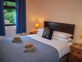 A bedroom with a bed and bedside tables at Ramson in Saltburn-By-The-Sea