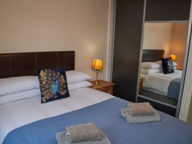 A bedroom with a bed and a bedside table at Ramson in Saltburn-By-The-Sea