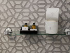 A bathroom shelf with soap and toilet paper at Ramson in Saltburn-By-The-Sea