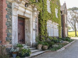 An entrance with a door and windows at Alston Hall near Mothecombe Beach