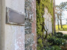 A nameplate on a wall at Alston Hall near Mothecombe Beach