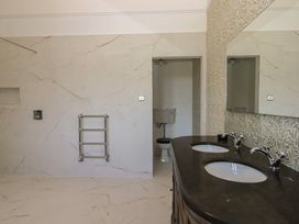 A bathroom with sinks and a toilet at Alston Hall near Mothecombe Beach