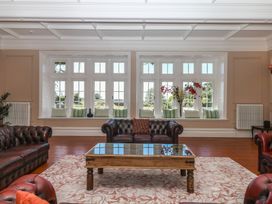 A living room with sofas and a coffee table at Alston Hall near Mothecombe Beach