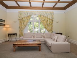 A living room with a sofa and coffee table at Alston Hall near Mothecombe Beach