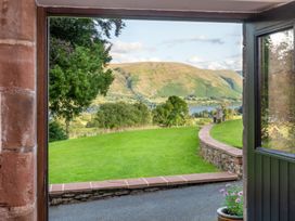 A view from a doorway showing grass and hills at Bank Barn, Wreay Watermillock