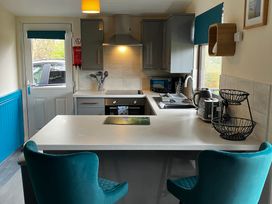A kitchen with countertop, sink, and appliances at Cowslip in Saltburn-By-The-Sea