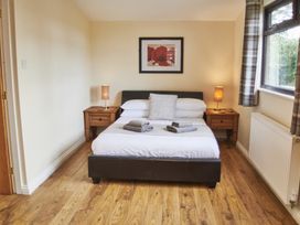 A bedroom with a double bed and nightstands at Cowslip Saltburn-By-The-Sea