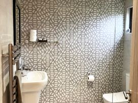 A bathroom with sink and toilet at Cowslip in Saltburn-By-The-Sea