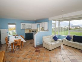 A living room with a dining area and kitchen at No.5 Beach Cottages, Keel, County Mayo