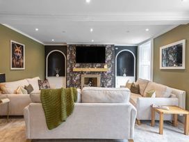 A living room with a sofa and coffee table at Snowdonia Manor in Dolgellau