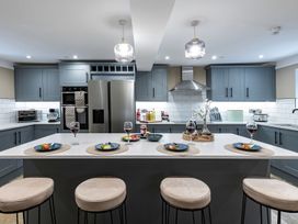 A kitchen with a large island and appliances at Snowdonia Manor in Dolgellau