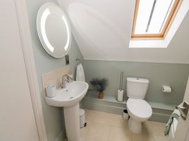 A bathroom with a sink and toilet at Little Acre in Church Lench near Harvington