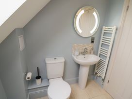 A bathroom with a sink and toilet at Little Acre, Church Lench near Harvington