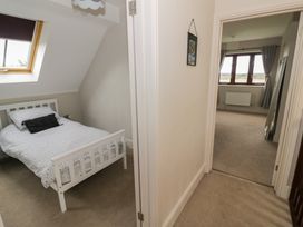 A bedroom with a bed and window at Little Acre Church Lench near Harvington