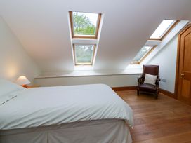 A bedroom with a bed and skylights at Bryn Isaf in Swyddffynnon near Pontrhydfendigaid