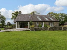 A house with a garden and trees at Bryn Isaf in Swyddffynnon near Pontrhydfendigaid