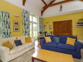 A living room with two sofas and a coffee table at Ty Cellin in Swyddffynnon near Pontrhydfendigaid