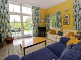 A living room with a sofa and coffee table at Ty Cellin in Swyddffynnon near Pontrhydfendigaid