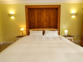 A bedroom with a double bed and nightstands at Ty Cellin in Swyddffynnon near Pontrhydfendigaid
