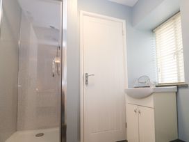 A bathroom with a shower and a basin at Mys Hedra Farm in St Buryan