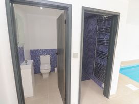 A bathroom with a toilet and sink at Mys Hedra Farm in St Buryan