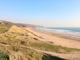 A beach with sand and ocean at Higher Merther Farm Shepherds Hut Sithney near Helston