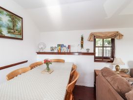 A dining room with table and chairs at The Dairy in Common Moor near Liskeard