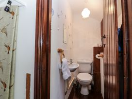 A bathroom with a sink, toilet, and towel at The Dairy Common Moor near Liskeard