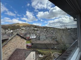 A view of houses and mountains at Rothay Cottage in Ambleside