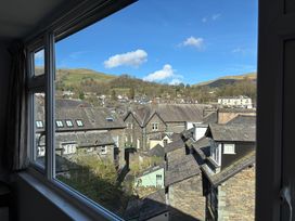 A view of rooftops and mountains at Rothay Cottage in Ambleside