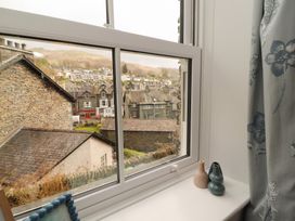 A window with a view of houses and a street at Rothay Cottage in Ambleside