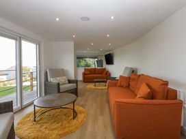 A living room with sofas and a coffee table at The Bay in Benllech