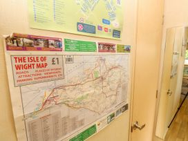 A map of the Isle of Wight on a wooden door in an indoor space