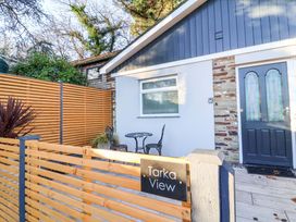 An outdoor entrance with a table and chairs at Tarka View in Bideford
