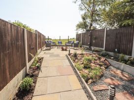 A garden area with paving stones and seating at 10 Keekle Terrace Cleator Moor