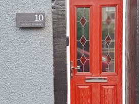 An entrance with a red door and nameplate at 10 Keekle Terrace in Keekle near Cleator Moor