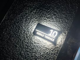 A nameplate displaying number 10 and the name Keekle Terrace at 10 Keekle Terrace in Keekle near Cleator Moor