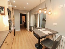 A kitchen with a table and chairs at 10 Keekle Terrace in Keekle near Cleator Moor