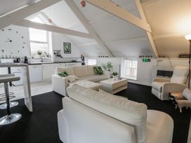 A living room with a sofa and coffee table at The Old Workshop in Dre-Fach near Lampeter