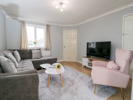 A living room with a sofa and television at 20 Honeycroft Bourton-On-The-Water