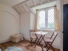A dinette with a table and chairs at Hole House in Branscombe