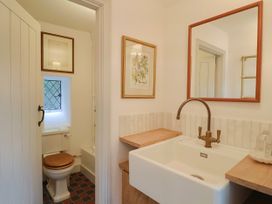 A bathroom with a sink and toilet at Hole House in Branscombe