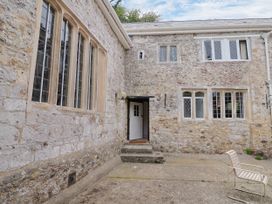 An outdoor area with a stone wall and steps at Hole House in Branscombe