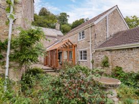 A conservatory near a stone house at Hole House in Branscombe