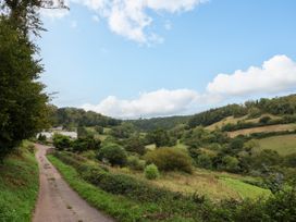 A landscape view with fields and trees at Hole House in Branscombe