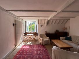 A snug with a table and chairs at Hole House in Branscombe