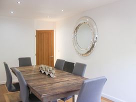 A dining room with a table and chairs at the Old Police House in Salcombe